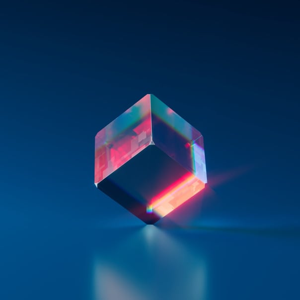 image of clear cube standing still on one one of its corners with dark blue background